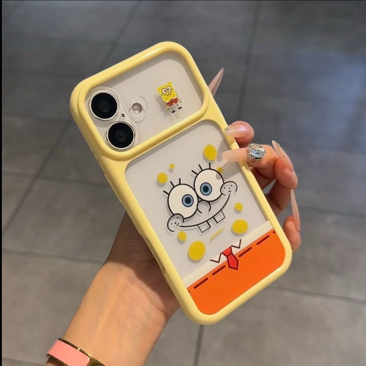 Adorable SpongeBob and Patrick Star printed phone case with unique split large camera window design, full edge anti-drop shockproof structure, glossy bright color frame, kawaii cartoon aesthetic, compatible with  iPhone