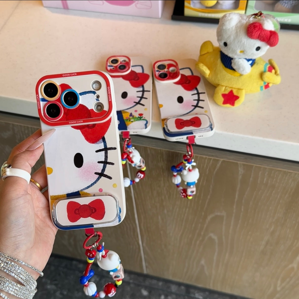Cute Cartoon Phone Case Built‑in Foldable Stand Beaded Hand Strap For iPhone Series